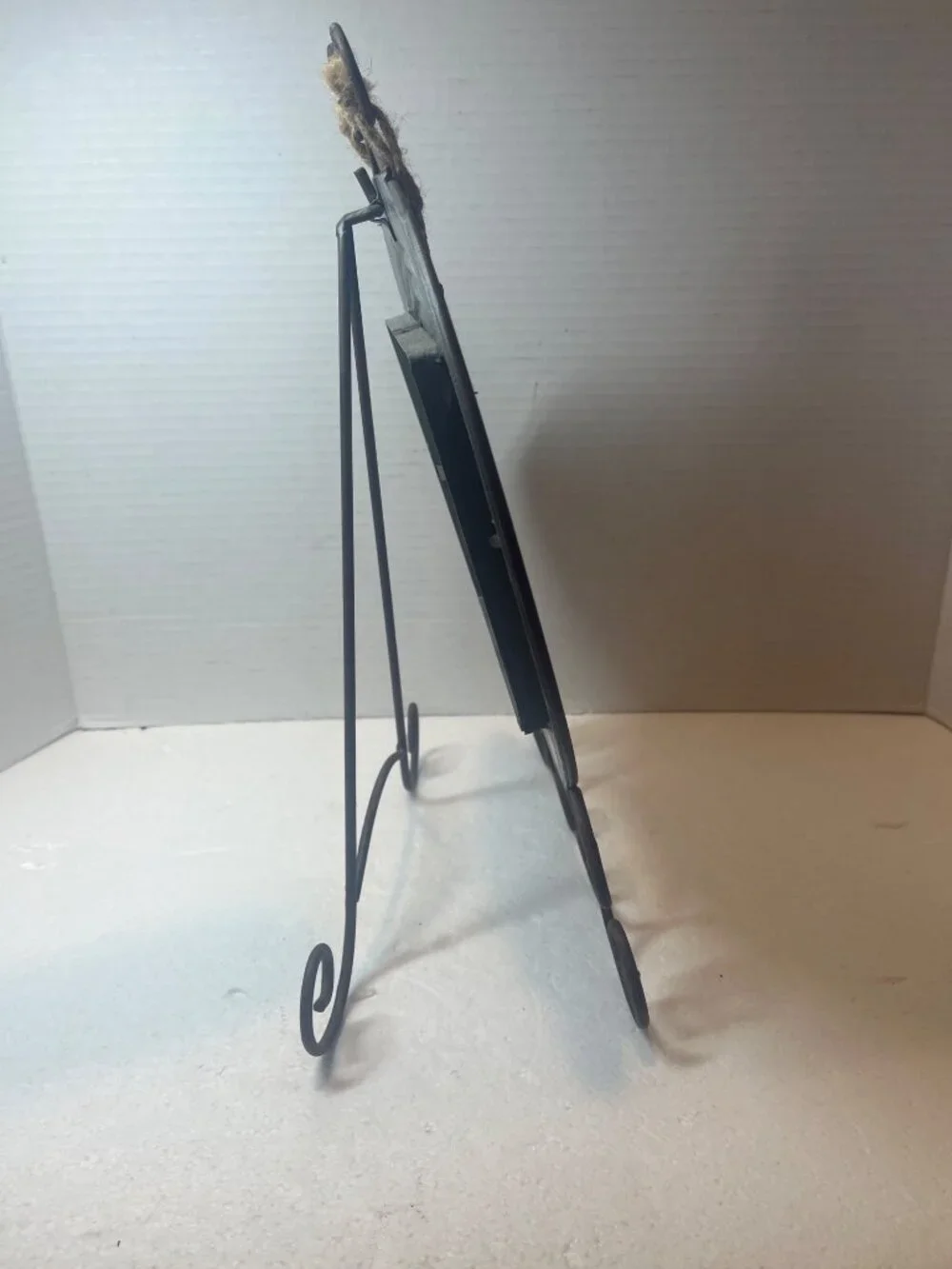 Rustic Metal Frame With Gardening Charm Accents And Decorative Scroll Stand